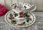 A Cup of Christmas Tea Teacup and Saucer by Warren Hanson For Sale