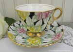 Vintage Adderley Stylized Pink and Yellow Roses on Black Chintz Teacup and Saucer Online